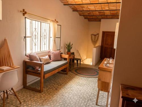 a living room with a couch and a window at Akoma San Pancho in San Francisco