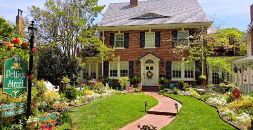 a house with a garden in front of it at Pettigru Place Bed & Breakfast in Greenville