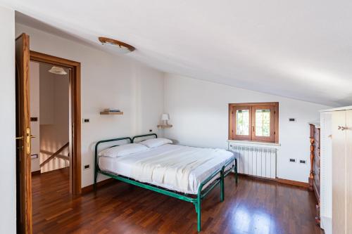 a bedroom with a bed in a white room at Vecchia San Giovanni - YourPlace Abruzzo in Fossacesia