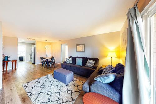 a living room with a couch and a table at Vineyards 2909 #3 in Branson