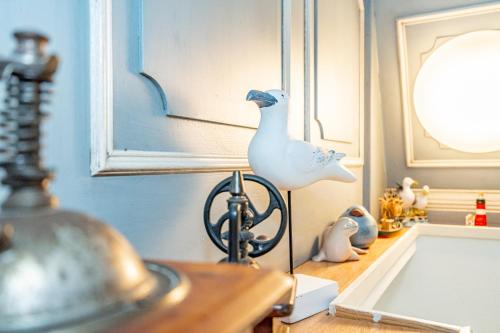 a figurine of a goose on a table in a room at Wattblick in Braderup