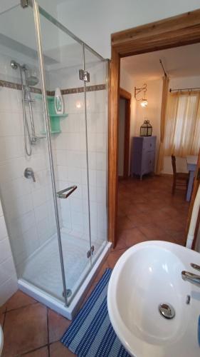 a bathroom with a shower and a white sink at Villetta Marausa - Birgi KITE in Marausa