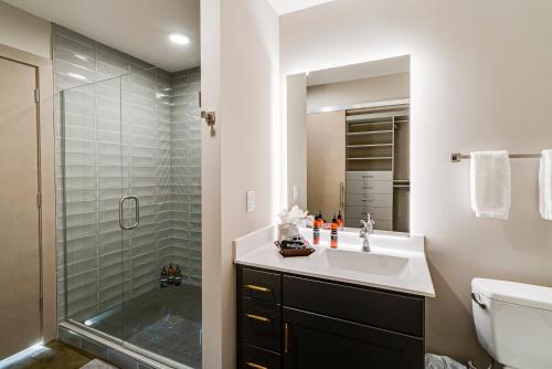 a bathroom with a sink and a shower at Sable 901 - Penthouse in Minneapolis