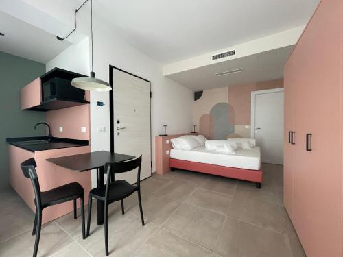 Un pat sau paturi într-o cameră la Arqué Apartments - Arco Centro
