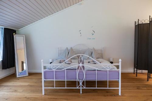 a bedroom with a white bed in a room at Muota River Loft & Muota Industry Apartment near Stoos in Muotathal
