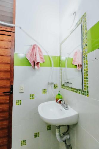 a bathroom with a sink and a mirror at Hostal Guadalajara in Guadalajara