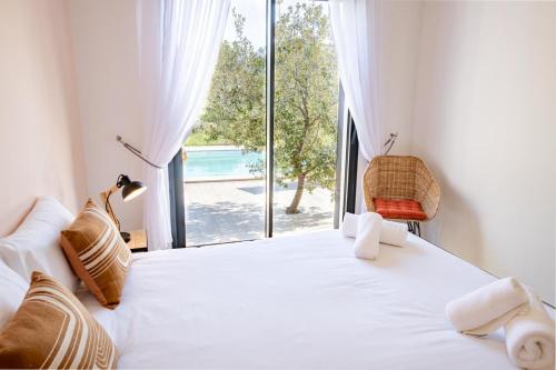 Llit o llits en una habitació de Villa Ena