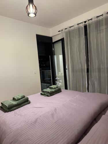 a bedroom with a bed with two green pillows on it at Dolce dimora in Bar