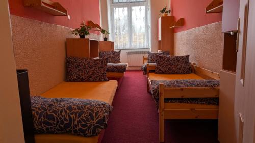 a waiting room with chairs and a window at Penzion Ruprechtice in Mezimesti