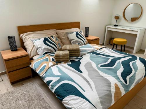 a bedroom with a bed with a zebra print bedspread at Pobyt na Mlýně in Červená Voda