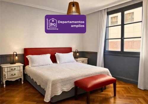 a bedroom with a bed and a sign that reads departmentsamines at Moreno 820 by DOT Suites in Buenos Aires