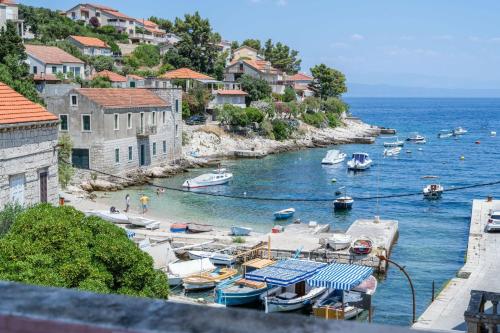 a group of boats are docked in a harbor at Apartmani Antula in Prigradica