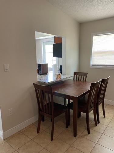 a dining room with a wooden table and chairs at Dolphin Cove in Sarasota