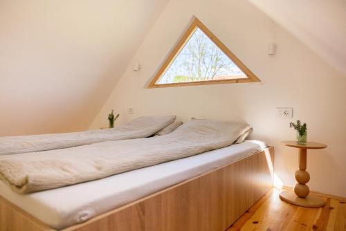 a bed in a room with a window at Watan A&D in Buna