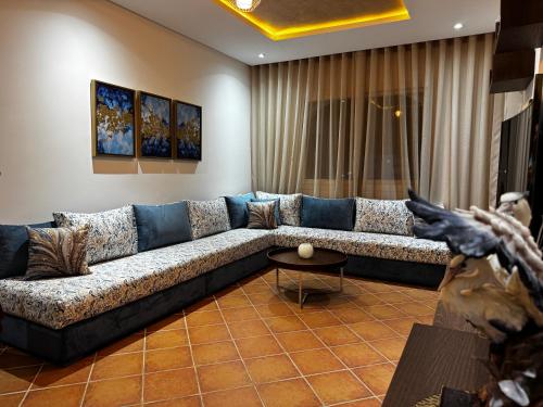a living room with a couch and a table at Mirador Capo Negro in Cabo Negro
