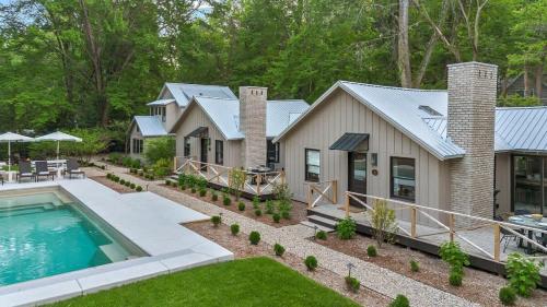 an aerial view of a house with a swimming pool at Townie 2 - The Sage by Juniper Holiday + Home Unit in Union Pier