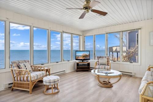 a living room with a view of the ocean at Lake Michigan Getaway by Juniper Holiday + Home in New Buffalo