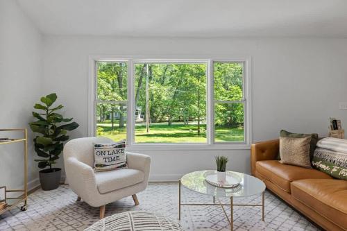 a living room with a couch and a table at The High Life by Juniper Holiday + Home in New Buffalo