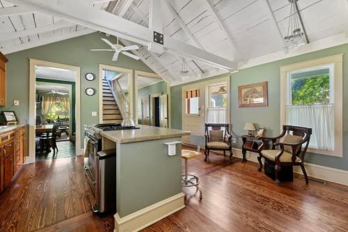a kitchen and living room with a stove and a dining room at The Fourth Oak by Juniper Holiday + Home in Three Oaks