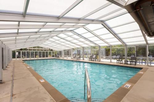 a large swimming pool with a glass ceiling at Sandy Shores in South Haven