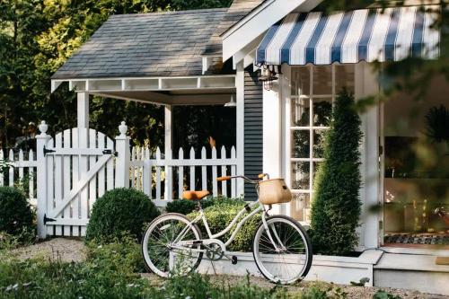 a bike parked in front of a house at Leo Cottage by Juniper Holiday + Home in Union Pier