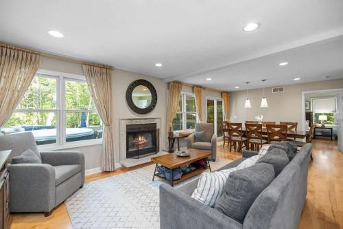 a living room with a couch and a fireplace at Blue Beech Cottage in Union Pier