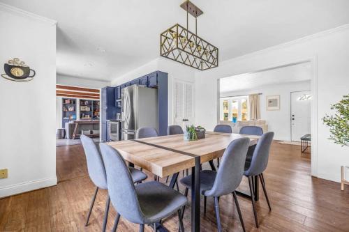 a dining room with a wooden table and blue chairs at Golden Crest Getaway in Stevensville