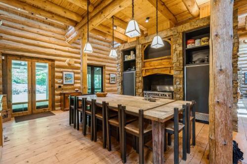 a kitchen with a large wooden table and chairs at Wilder Woods in Michiana
