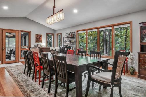 a dining room with a table and chairs at Hearth & Timber in Bridgman