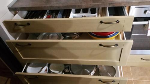 a drawers in a kitchen with at Tündérgyöngye Apartmanház in Zirc