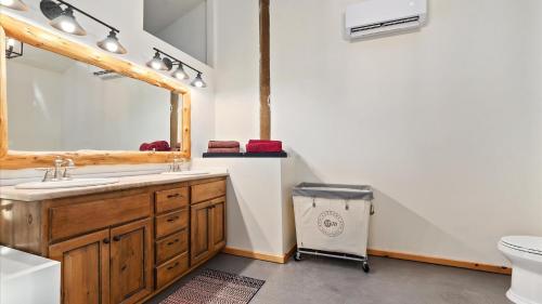 a bathroom with a sink and a mirror at Yurt 2 - The Gold Miner in Idaho City