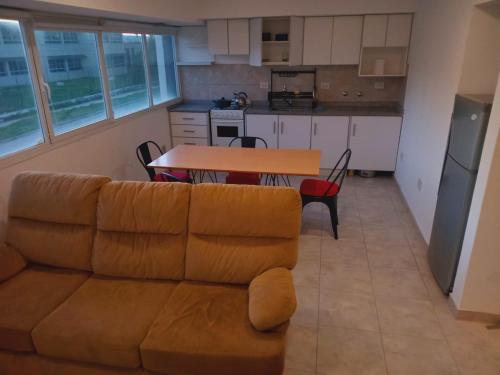 a living room with a couch and a table at Bernal Alquileres in Viedma