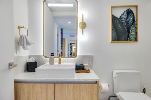 a bathroom with a sink and a mirror at Stunning Lux 2 Bed 2 Bath with Panoramic View from Balcony in Miami
