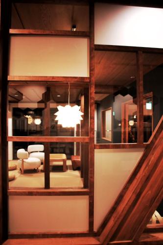 a view of a living room with a chandelier at SAKADONEguesthouse in Iijima