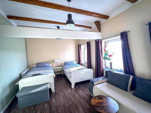 a living room with two beds and a couch at Holiday Home in Konz in Konz