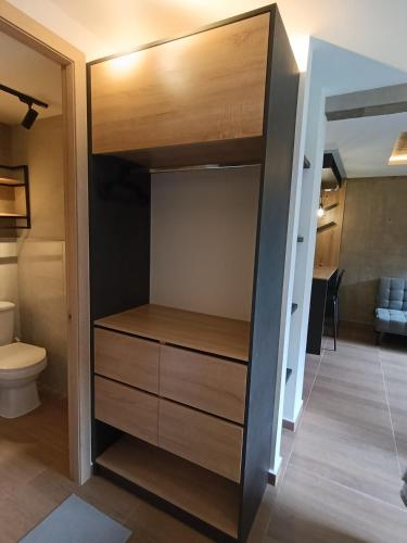 a room with a bunk bed and a toilet at MOCA Living in Cali