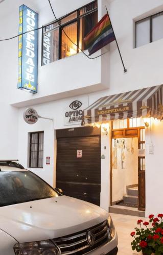 a car parked in front of a garage at Hospedaje Paris in Cusco