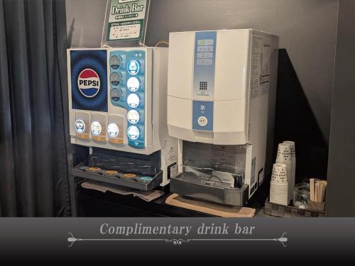 acomputer drink bar is sitting on a table at Hotel Crest Hirai (Adult Only) in Tokyo