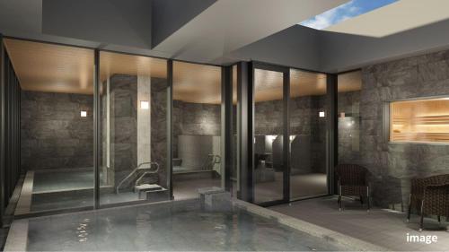a large bathroom with a tub and a shower at Village Atami in Atami