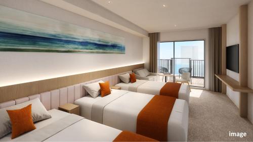 a hotel room with two beds and a television at Village Atami in Atami
