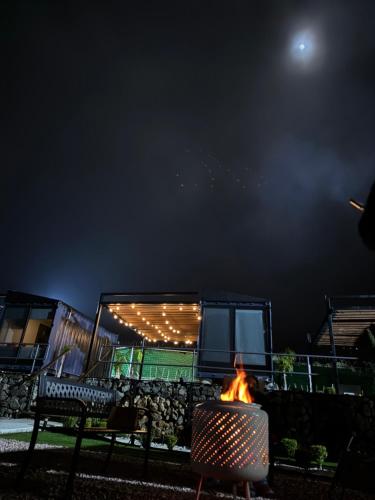 a fire pit in a yard at night at cabañas aldebaran in Ciénega Redonda