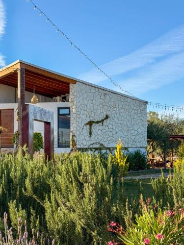 a building with a bird painted on the side of it at Valle Soléa in Valle de Guadalupe