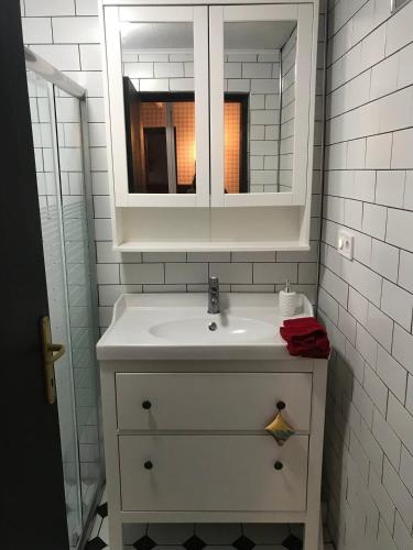 a bathroom with a white sink and a mirror at Uludag ztrk Mountain House in Kirazlı