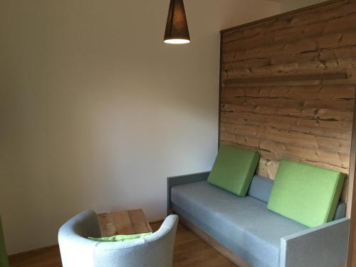 a living room with two chairs and a couch at Ferienwohnung Neubau in Alpbach