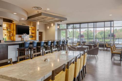 a large dining room with a large table and chairs at Cambria Hotel Denver International Airport in Aurora
