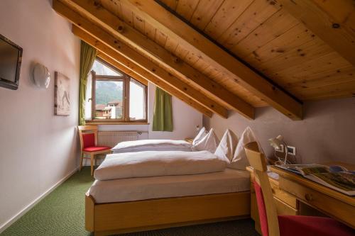 Postel nebo postele na pokoji v ubytování Hotel Christian