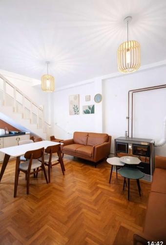 a living room with a couch and a table at Villa Jakov in Podgorica