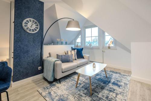 a living room with a couch and a table at Lee in Zingst