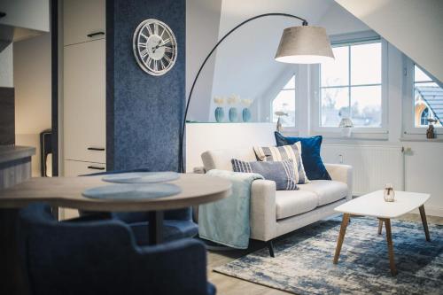 a living room with a couch and a table at Lee in Zingst