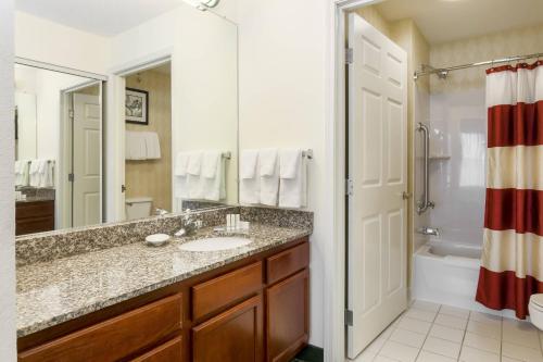 a bathroom with a sink and a shower at Residence Inn by Marriott Oklahoma City South in Oklahoma City